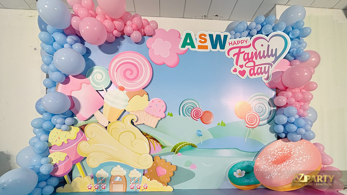 Backdrop chính ngày hội gia đình ASW Happy Family Day 2025 concept Xứ Sở Kẹo Ngọt với bong bóng hồng xanh pastel do AZparty thiết kế