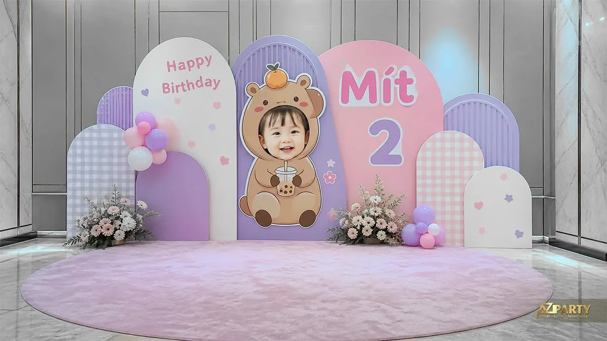 Backdrop Capybara tím hồng với khung vòm và bàn bánh nhỏ