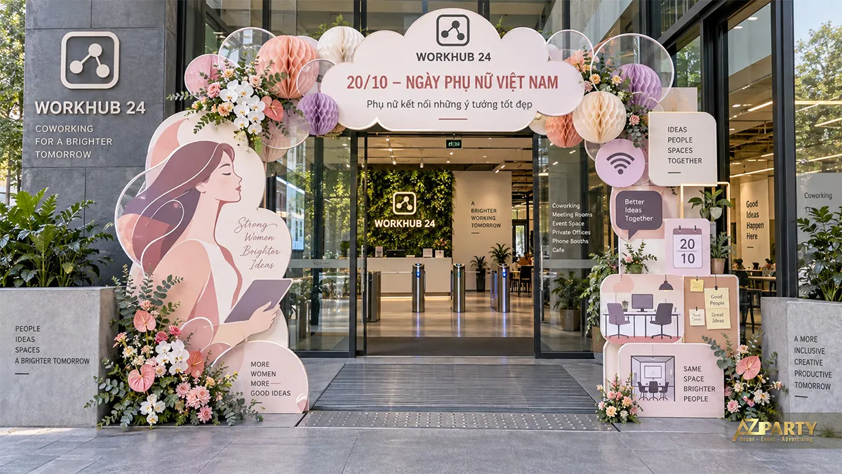 Cổng chào 20/10 màu hồng cho không gian làm việc chung với lịch, bàn làm việc và bóng giấy