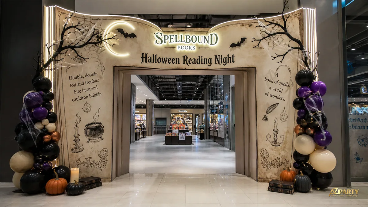 Cổng đêm đọc sách tạo hình cuốn sách mở, kết hợp bóng tím đen và họa tiết Halloween