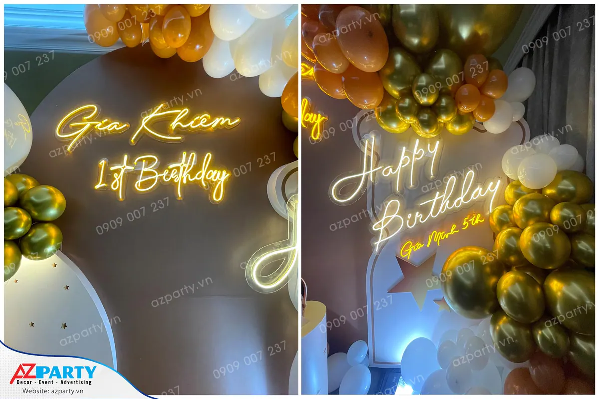 Cận cảnh hai biển chữ neon LED vàng sáng ấm cúng 'Gia Khiêm 1st Birthday' và 'Happy Birthday Gia Minh 5th' trên nền backdrop tròn màu nâu sữa nhạt.