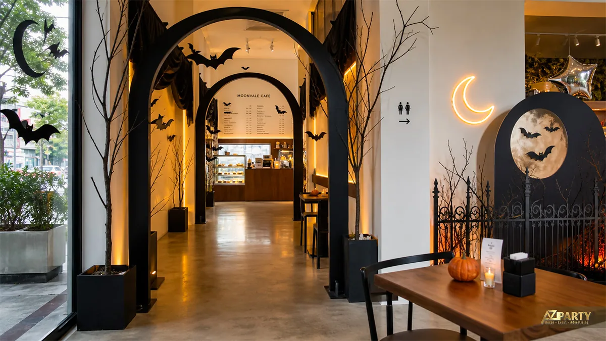 Lối đi Moonvale Cafe với cổng vòm đen, dơi, trăng neon và tiểu cảnh nghĩa địa