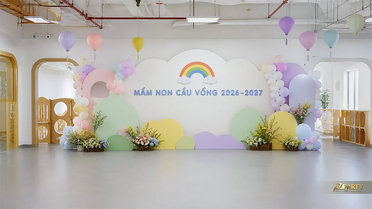 Sân khấu khai giảng mầm non Cầu Vồng màu pastel với mây, bóng và đèn lồng treo