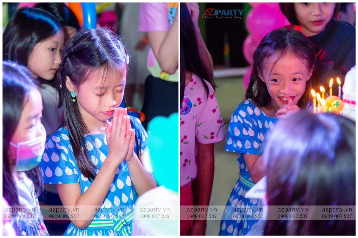 Hình ảnh bé gái chắp tay cầu nguyện ước điều ước trước khi thổi nến mừng sinh nhật cùng bạn bè.