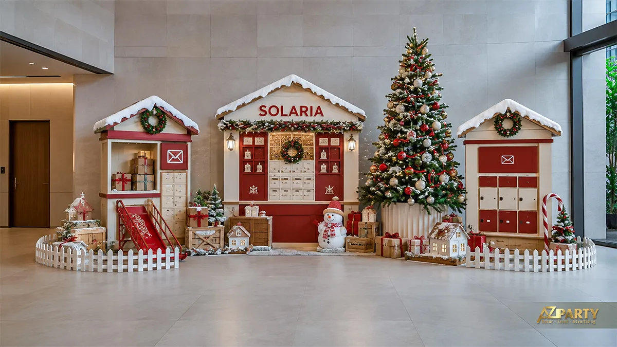Tiểu cảnh bưu điện Noel đỏ trắng với ba gian nhà và hàng rào thấp
