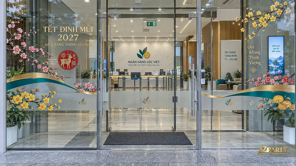 Decal cửa kính ngân hàng với dải mờ, hoa mai đào và thông điệp năm mới