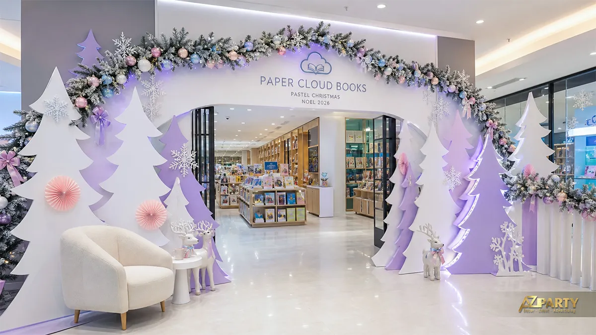 Lối vào Paper Cloud Books với cây giấy trắng tím, vòng lá và ghế ngồi