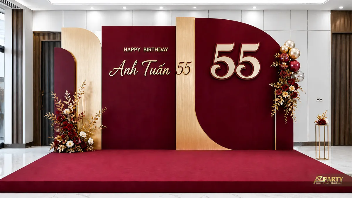 Backdrop sinh nhật Anh Tuấn 55 tuổi tông burgundy gold, phối số 55, hoa và bóng ánh kim.