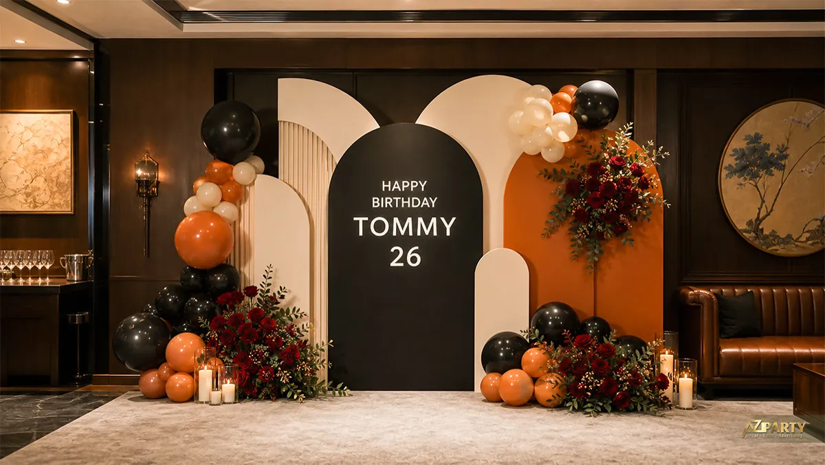 Góc tiệc Tommy 26 tuổi phối đen cam kem với hoa đỏ