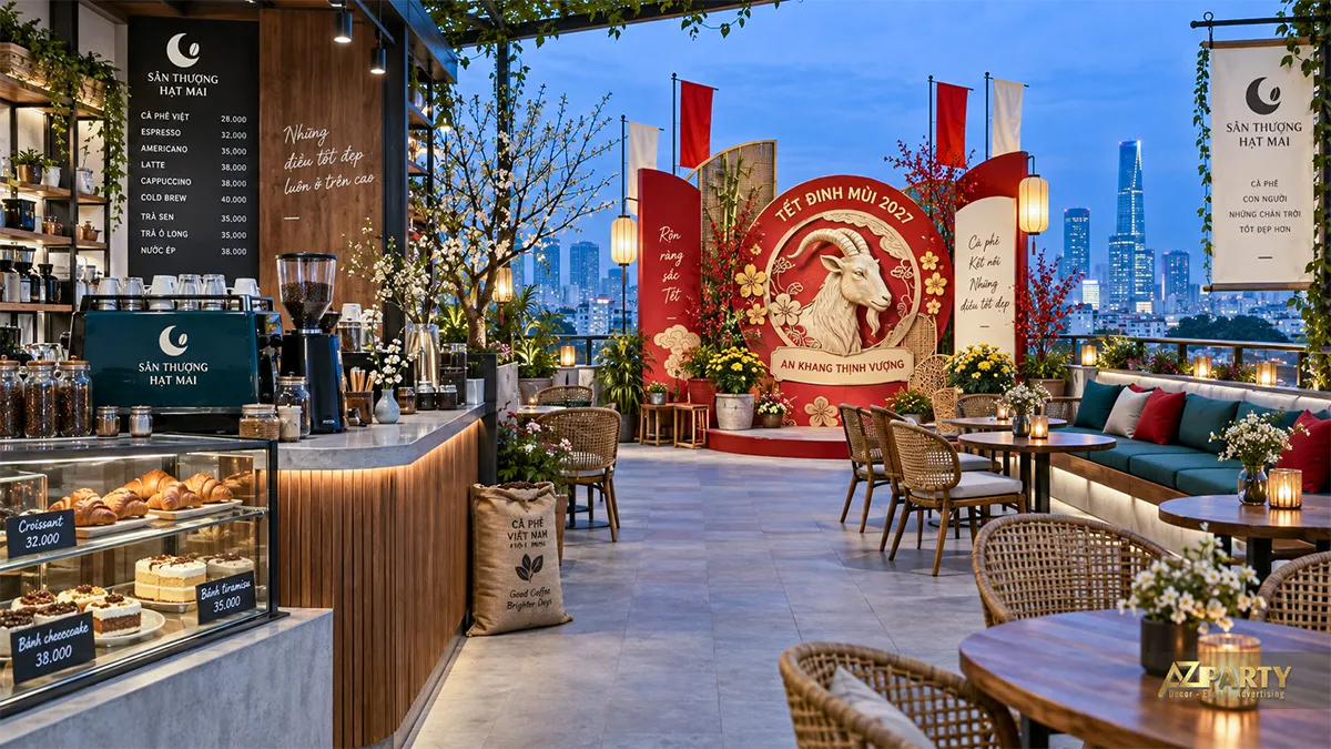 Sân thượng Hạt Mai về đêm với backdrop tròn hình dê và cảnh thành phố