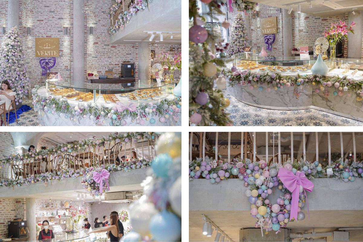 Quầy bánh ngọt và không gian tầng lửng được trang trí Giáng sinh với hoa, bóng pastel và ruy băng lớn màu tím. Cây thông phủ tuyết và ánh sáng dịu mang lại cảm giác sang trọng, ngọt ngào và tràn đầy không khí lễ hội.