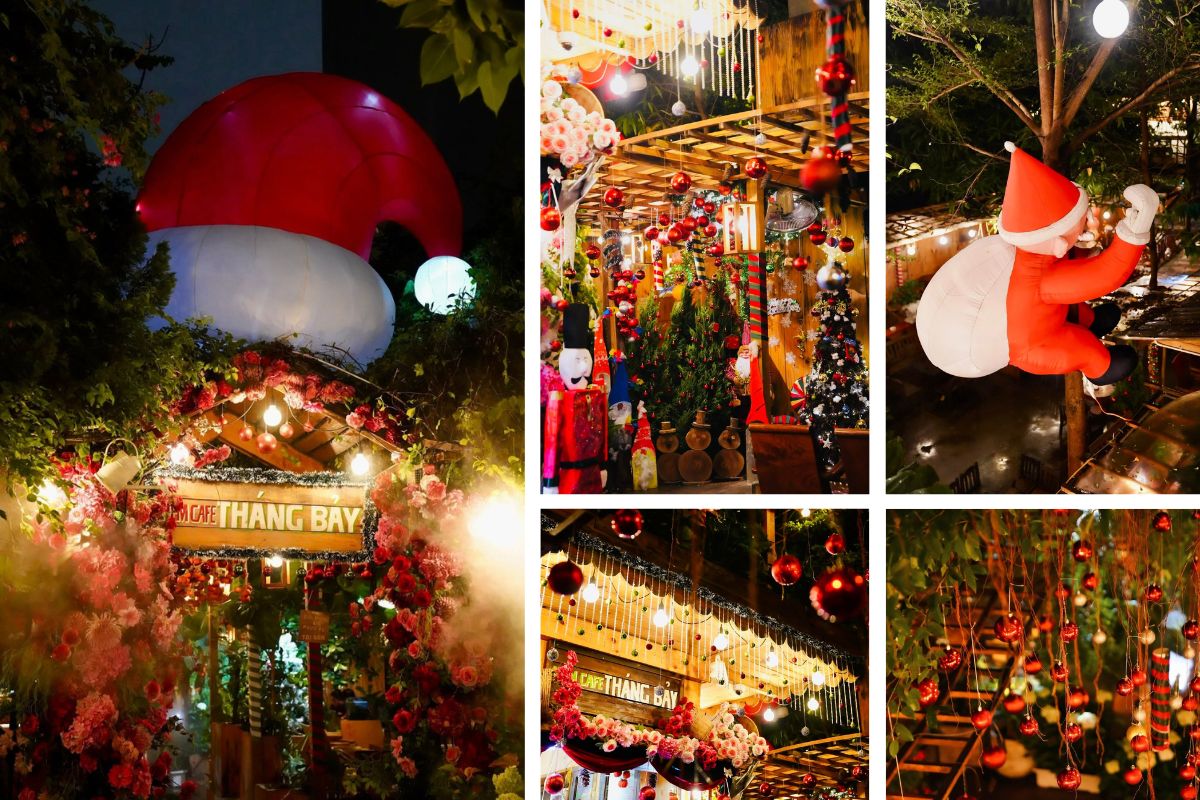 Quán cà phê được trang trí rực rỡ trong mùa Giáng sinh với cổng hoa đỏ hồng, bóng đèn vàng ấm và quả châu treo lấp lánh. Nổi bật là ông già Noel khổng lồ đang leo cây và chiếc mũ Noel cỡ lớn trên mái, tạo không khí vui tươi và sôi động giữa không gian xanh mát.